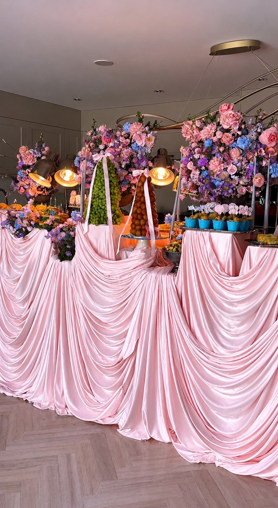 Pink draped styling setup showing a luxurious event finish
